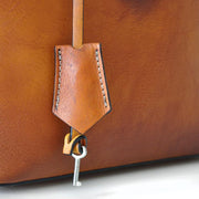 Close-up of Pratesi Versilia brown leather hand bag. 