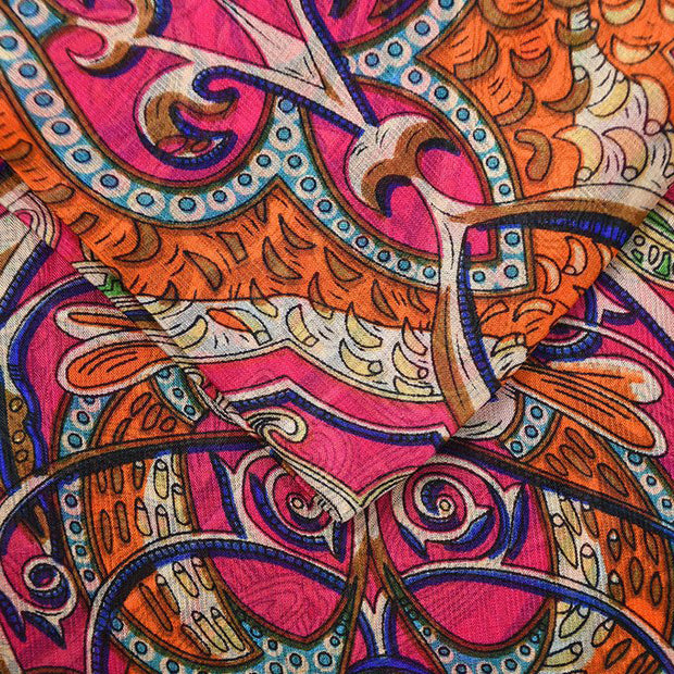 Close-up of Belmore Boutique pink Celtic print silk scarf. 